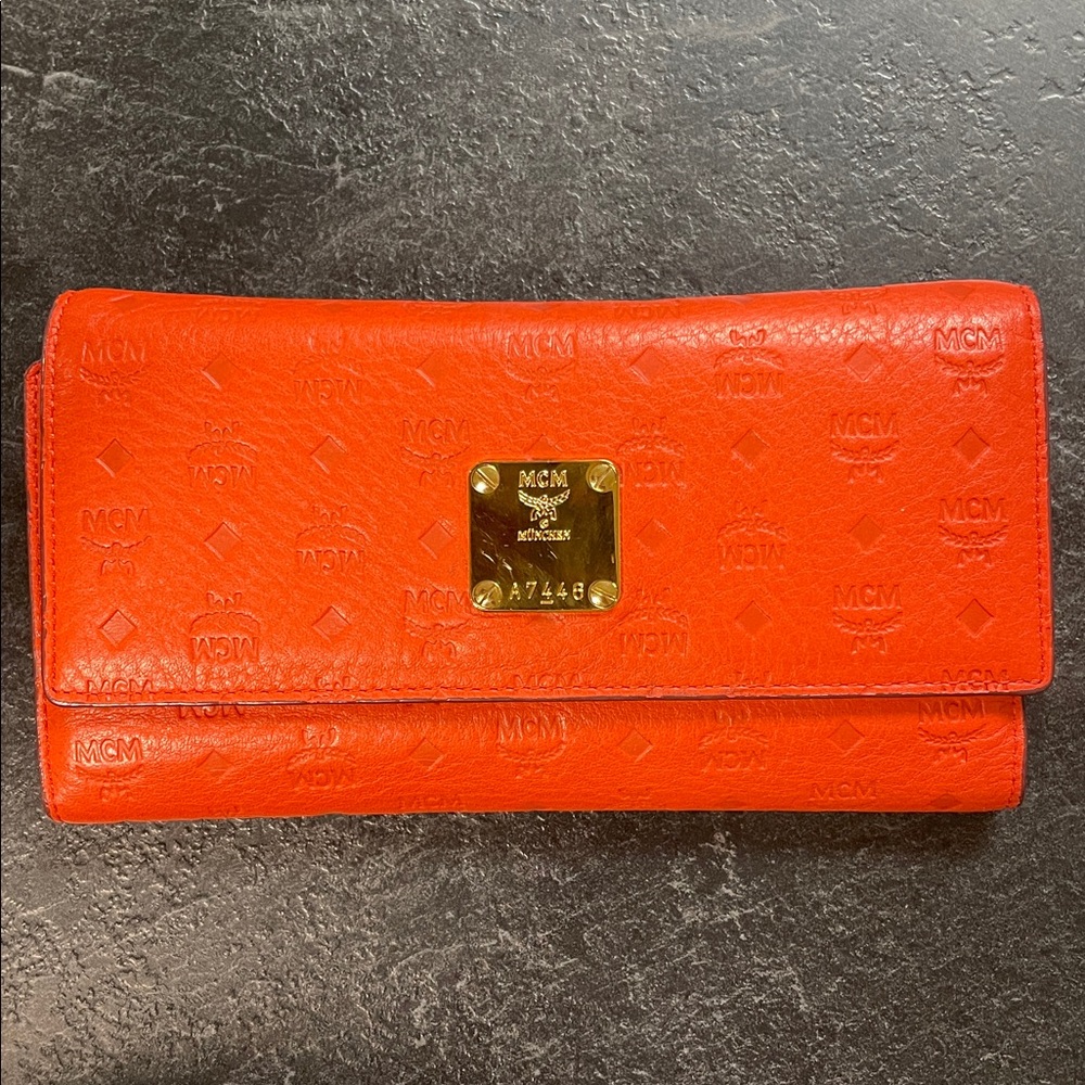 MCM Bright Orange Embossed Leather Continental Wallet with Gold Plate
